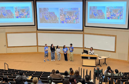 pharmacy students presenting photos from their mission trips around the world