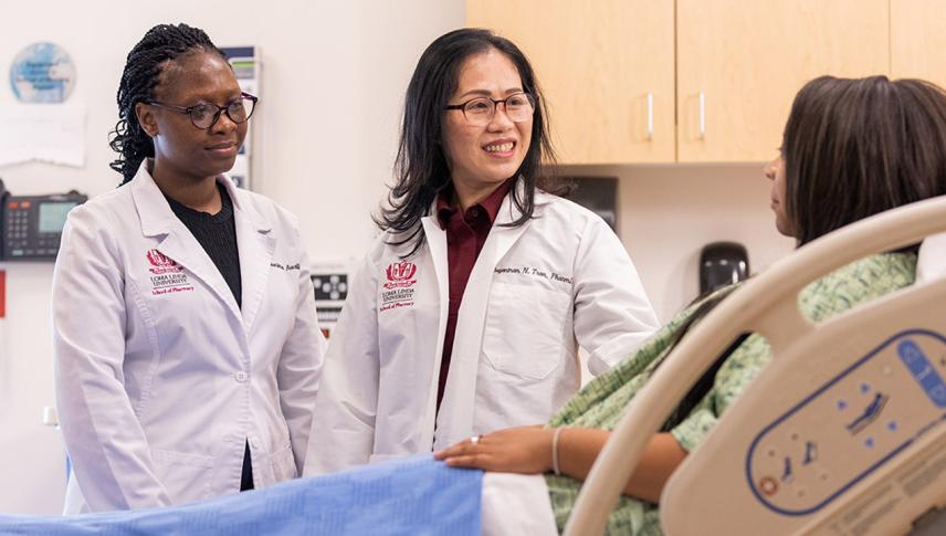 nurses at patient bedside