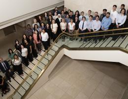 Class of 2030 standing on steps inside the Wong Kerlee building on Loma Linda University Campus
